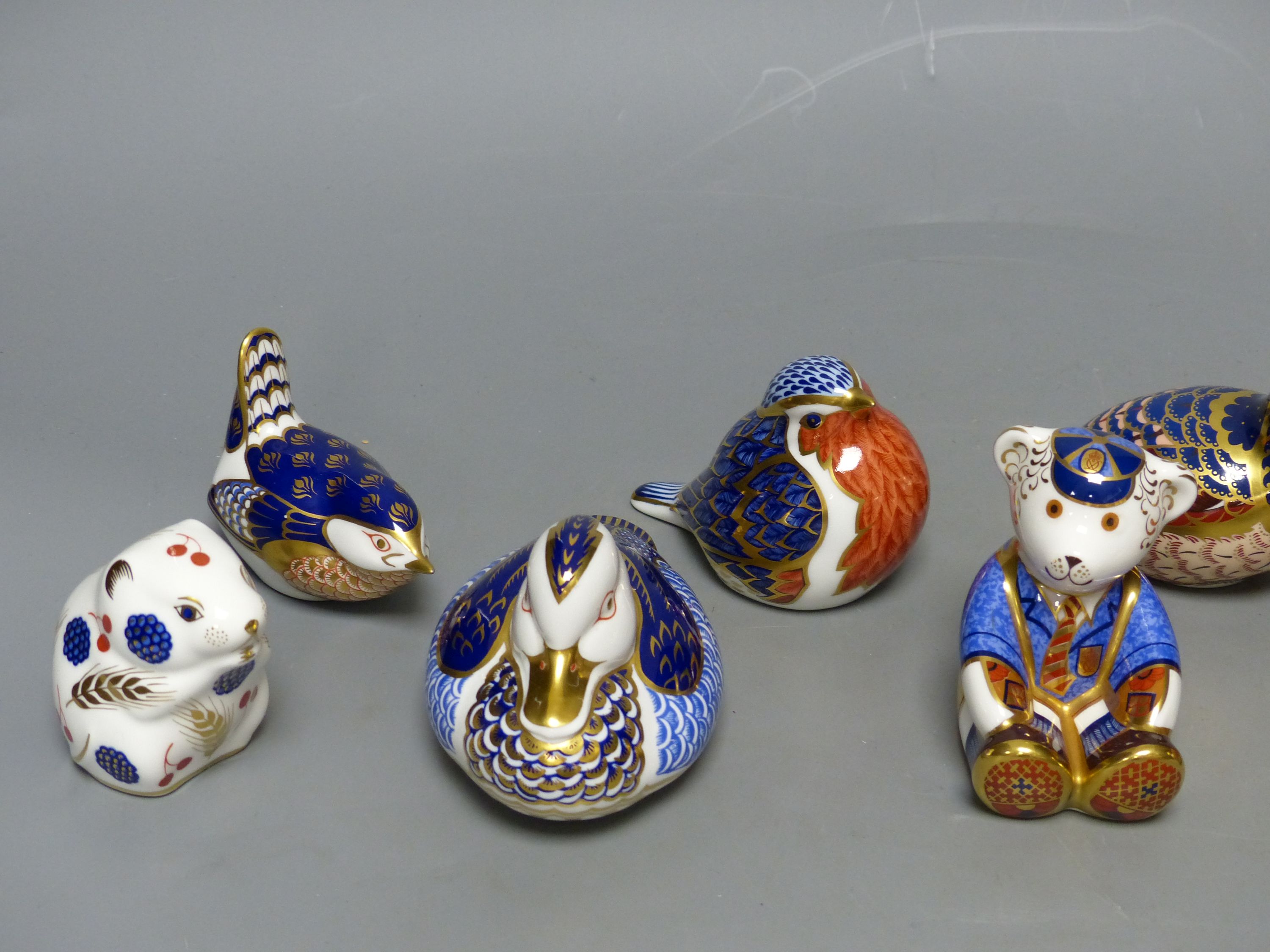 Eight Royal Crown Derby animal or bird paperweights